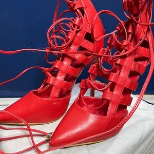red lace up heel with gold aglets
